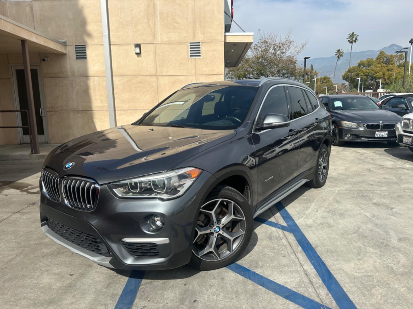 2016 Gray /Black BMW X1 leather (WBXHT3Z34G4) with an 4 CYLINDER engine, Automatic transmission, located at 30 S. Berkeley Avenue, Pasadena, CA, 91107, (626) 248-7567, 34.145447, -118.109398 - Crown City Motors is a used “Buy Here Pay Here” car dealer in Pasadena CA. “Buy Here Pay Here” financing, means that when you purchase your vehicle from our dealership, that you make the payments to the dealership as well. We do not need the banks approval to get you approved for a used auto - Photo#1